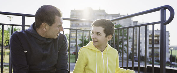 child sitting with his mentor